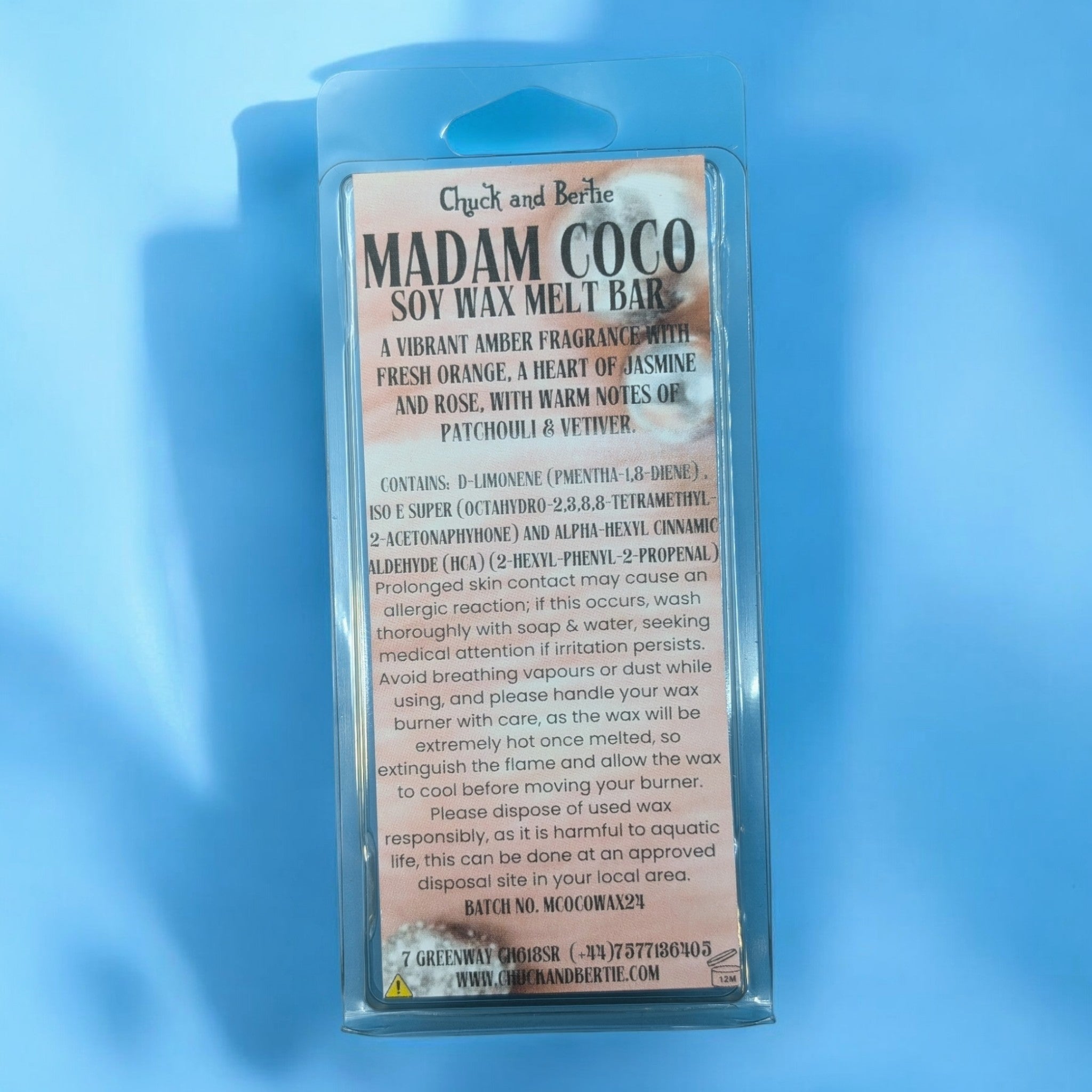 The wax bar in its packaging on a blue background.