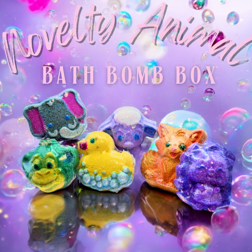 The background is lilac with pink and purple bubbles. There is an Elephant, Monkey, Rubber Duck, Lamb, Fox, and Hedgehog shaped bath bombs shown in a group, to show what you get in your Novelty Bath Bomb Box
